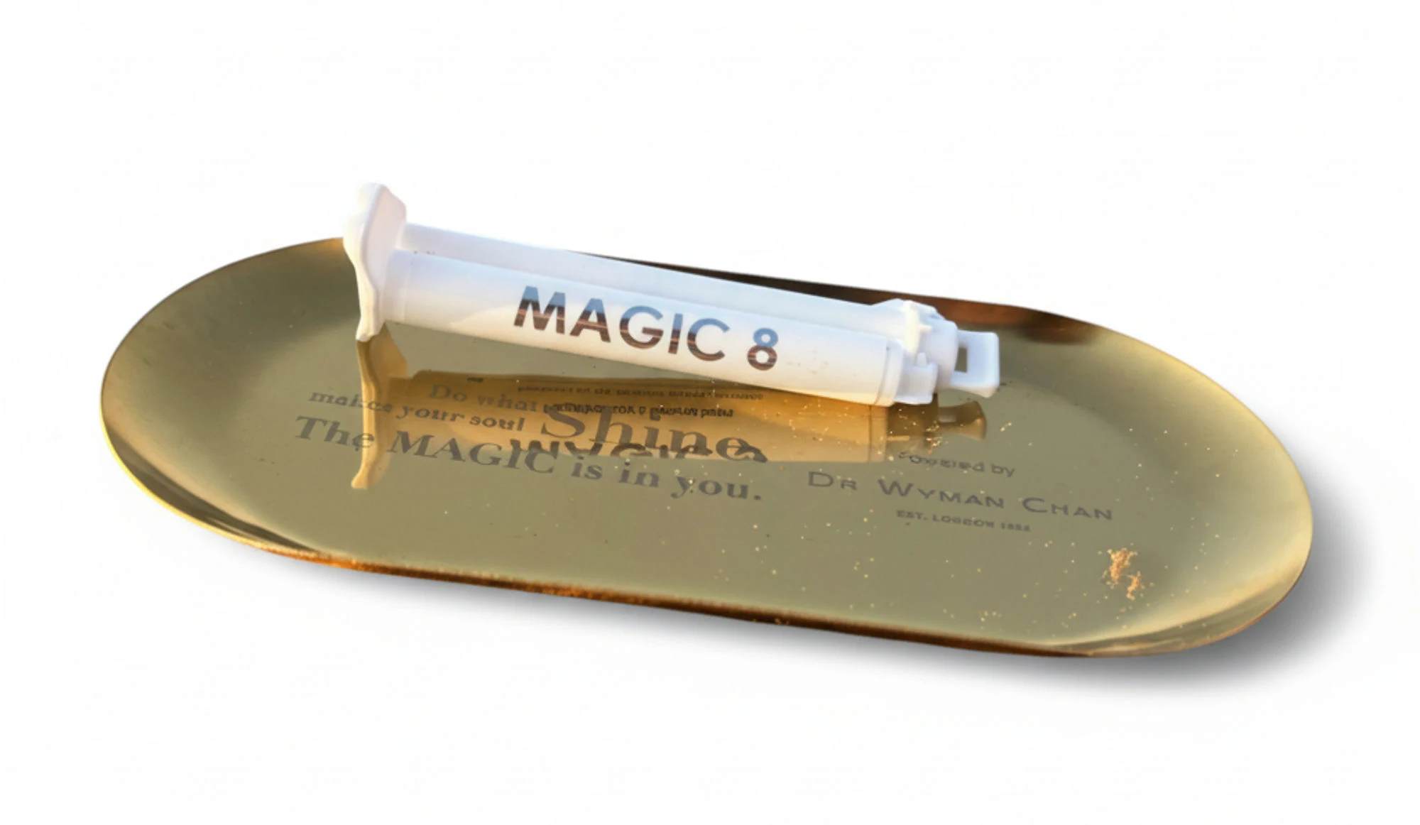 Magic 8 whitening syringe on gold tray